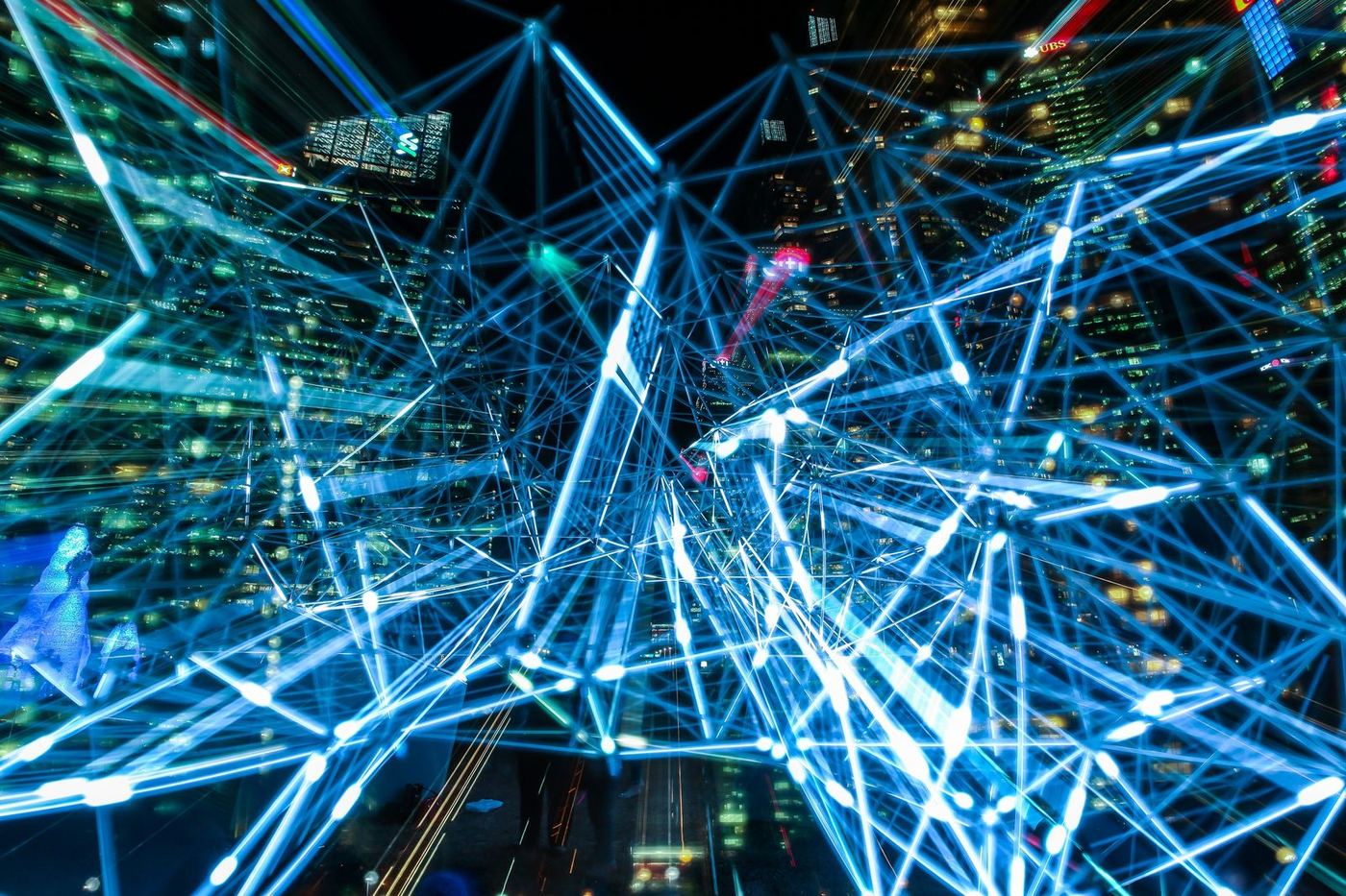 Futuristic city connected by a glowing blue network