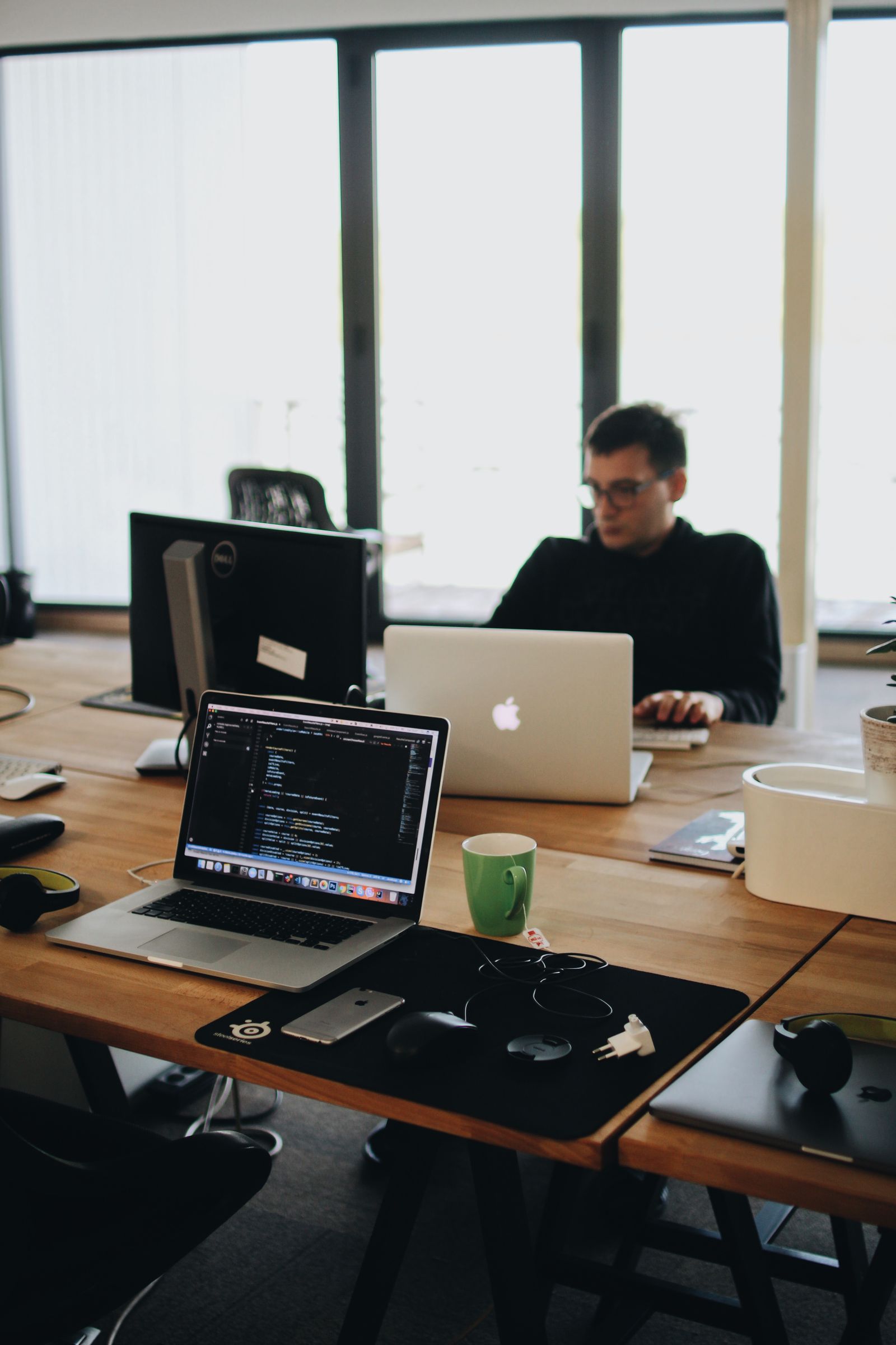 Web developer working with multiple devices