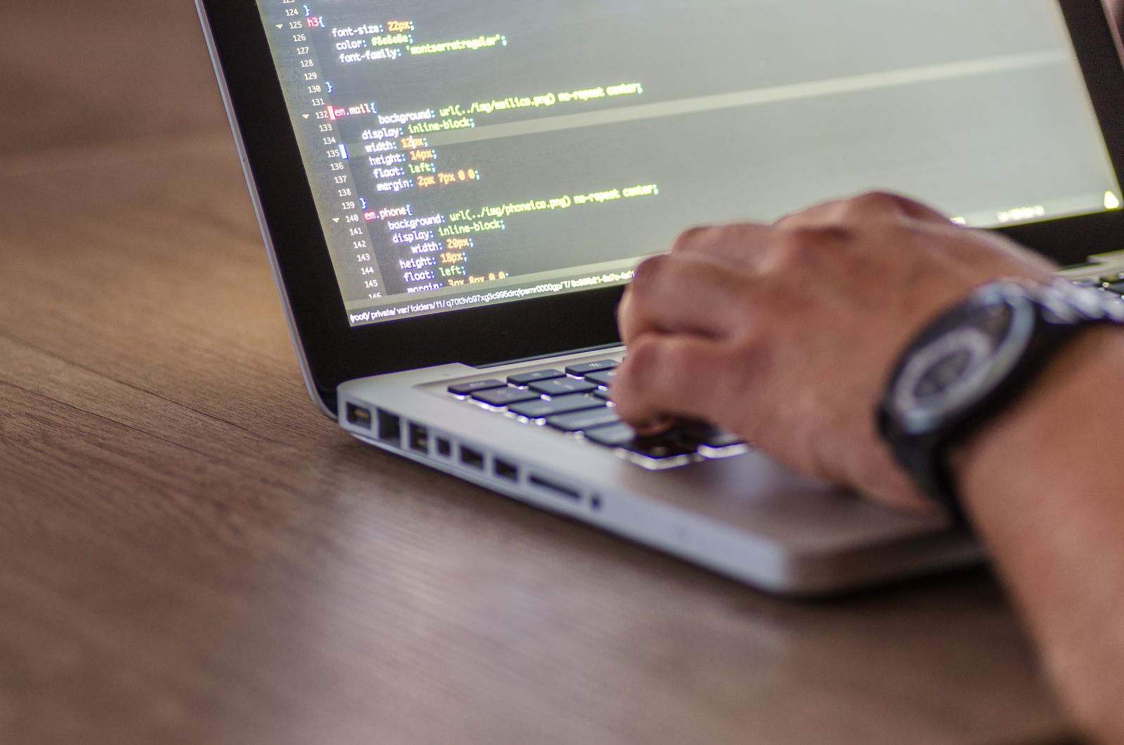 Close-up of coding on a laptop