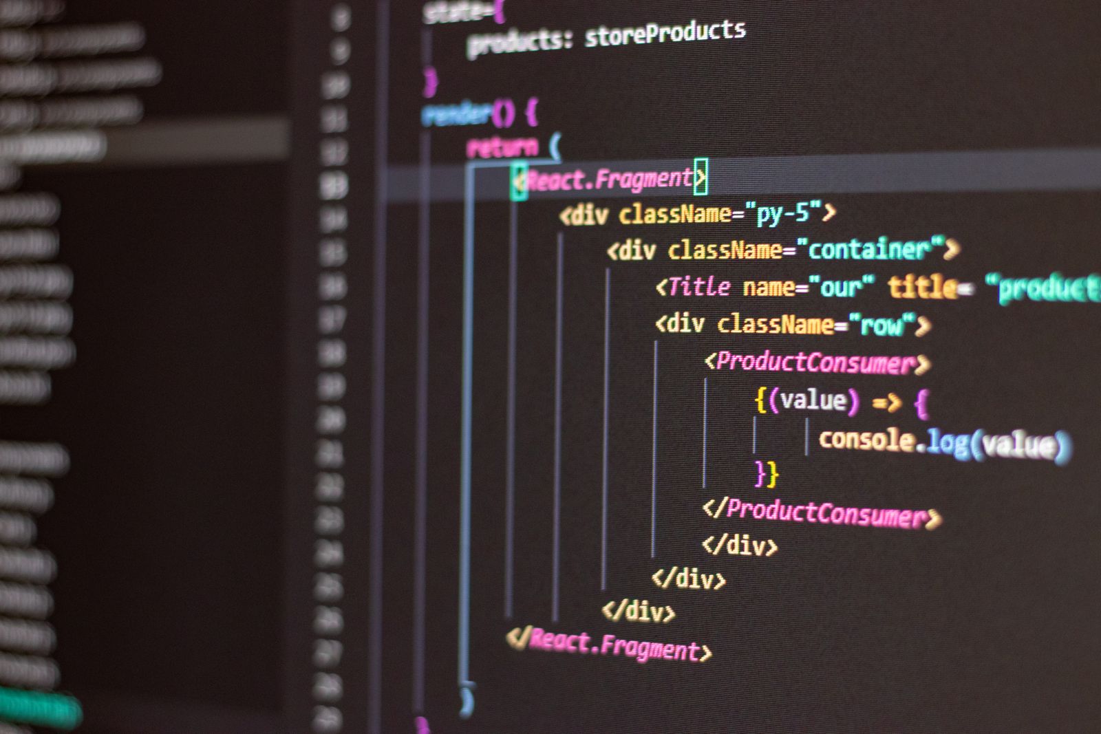 Person in blue hoodie programming late at night