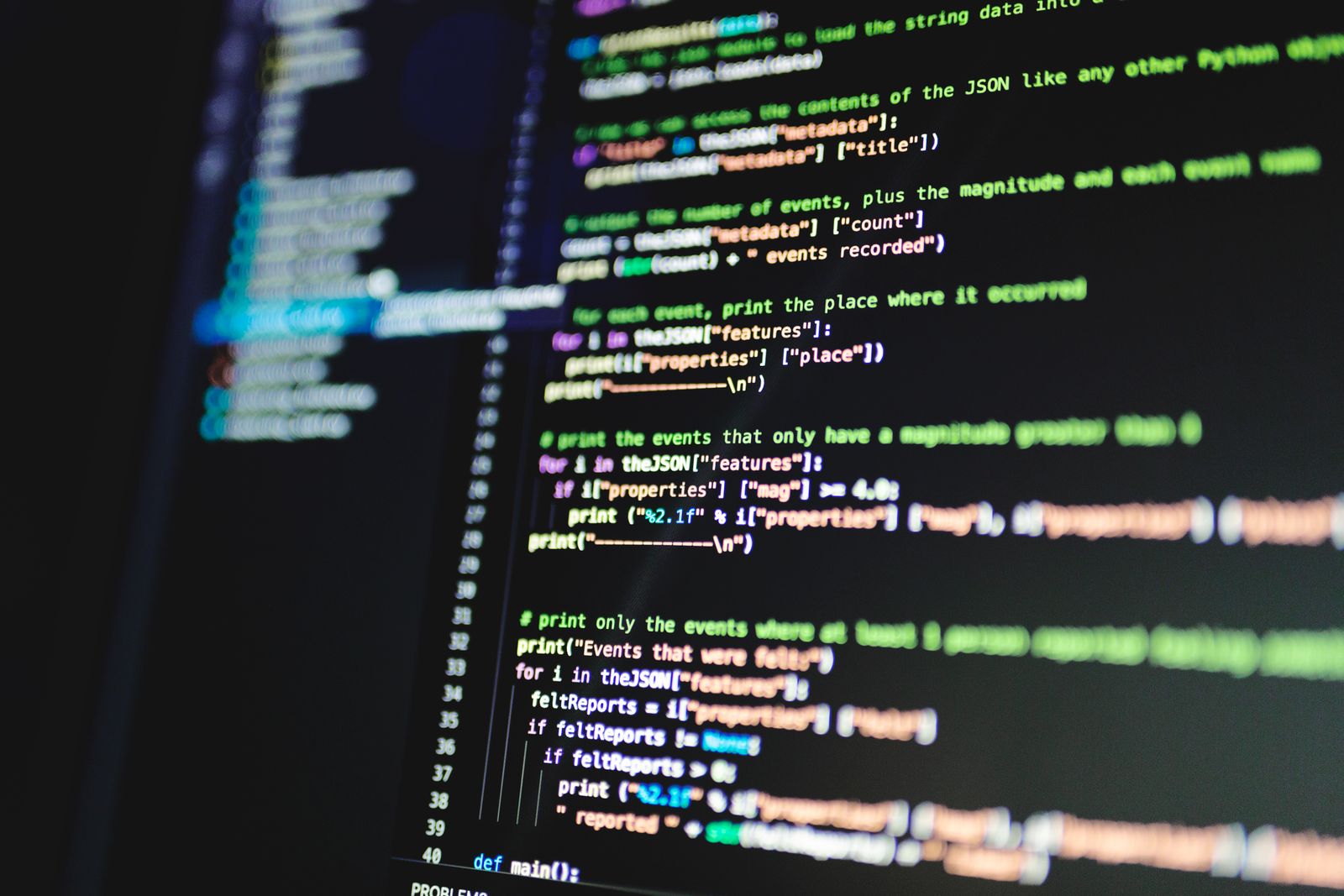 Code on a monitor against a dark background