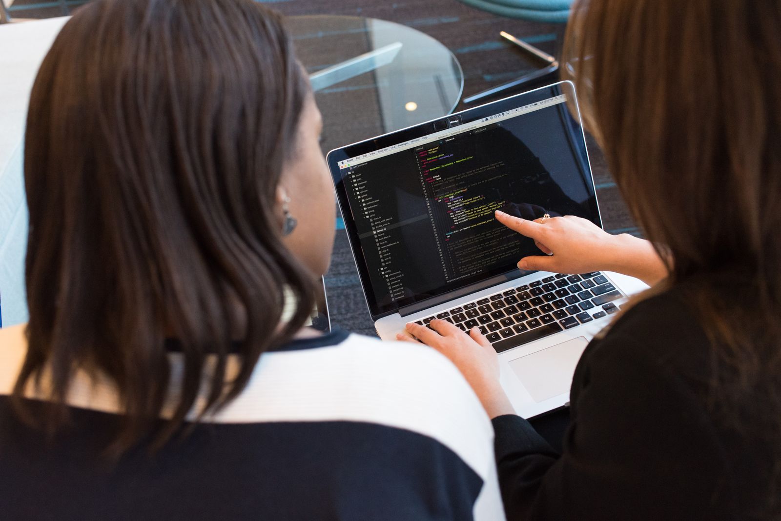 Developer working at a bright desk with monitors
