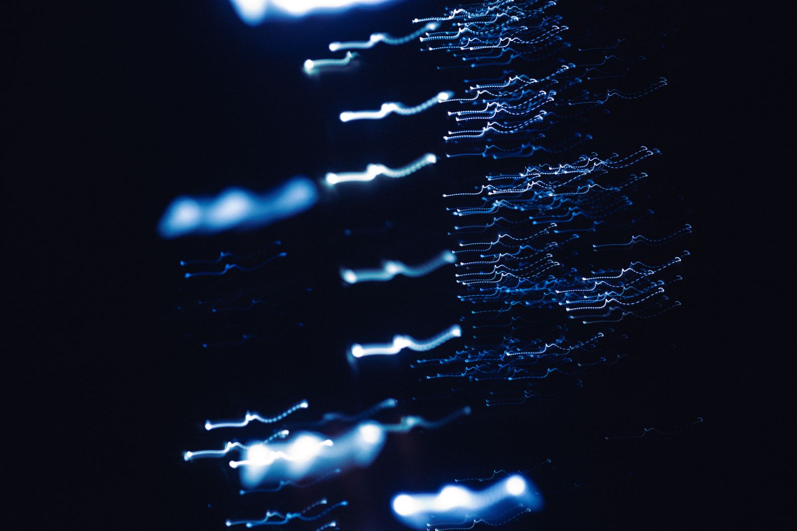 Blue light patterns on a dark background